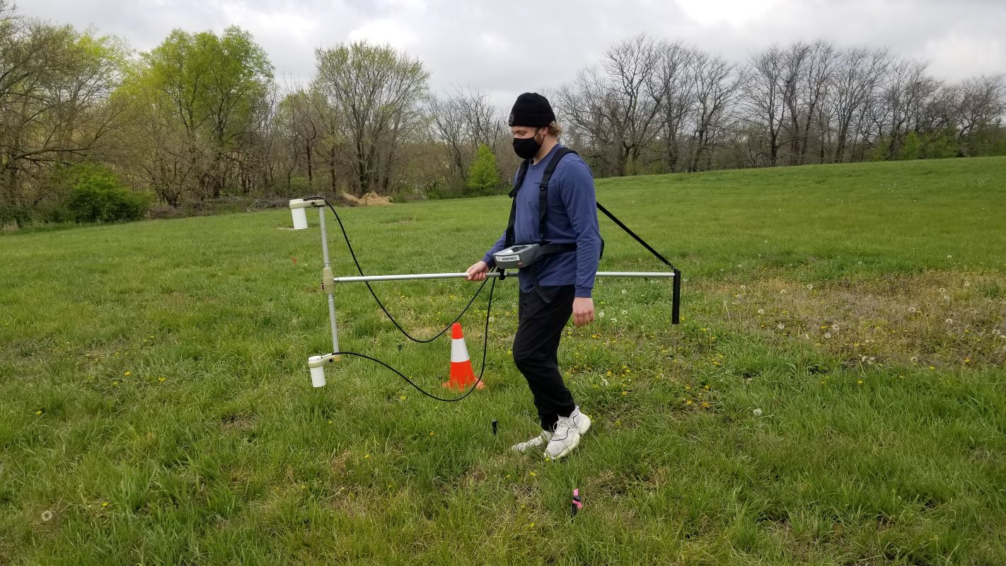 Alex Walker uses geophysical methods to look at lateral variations in soil properties, and for the presence of buried objects such as foundations or tanks, during a workshop at the KU Edwards Campus on April 16.