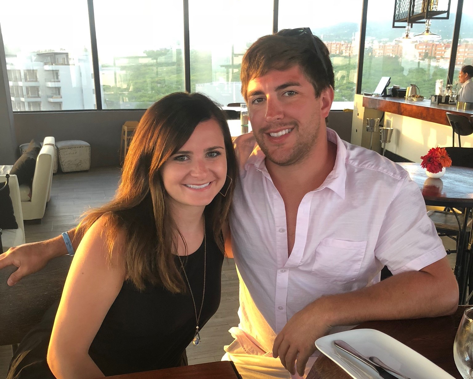 Brendan Postle (right) sits with girlfriend at restaurant