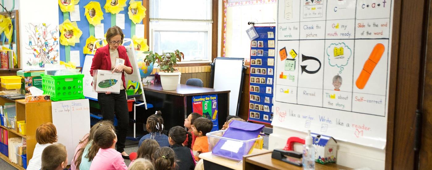 Teacher stands in front of her early childhood class 