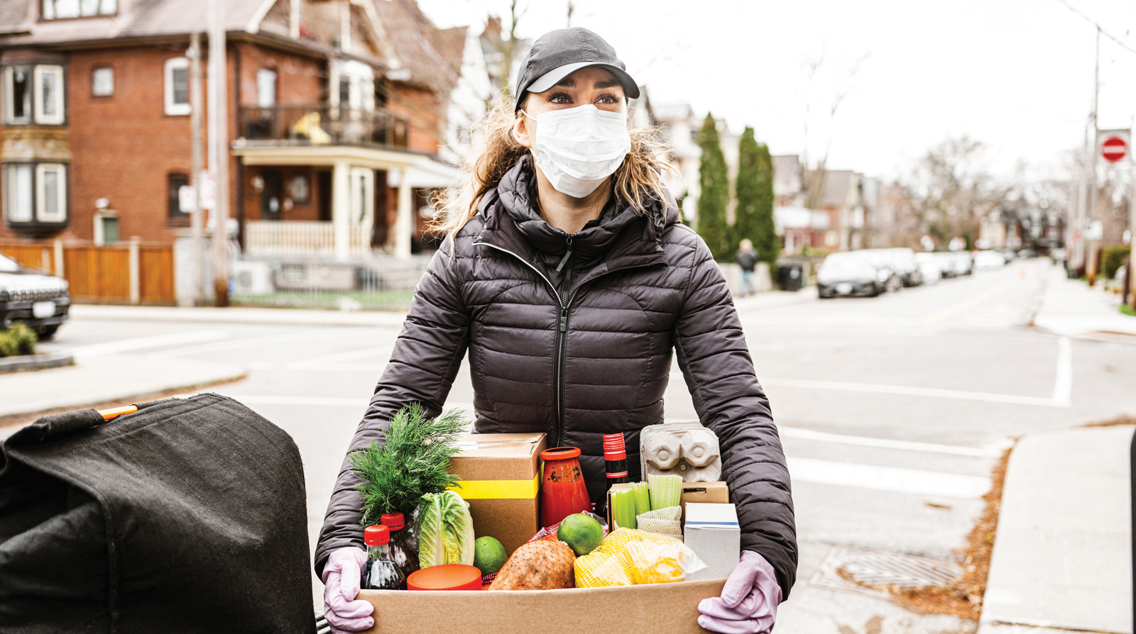 Public health worker serves her community by delivering nutrient-rich foods to underserved areas.