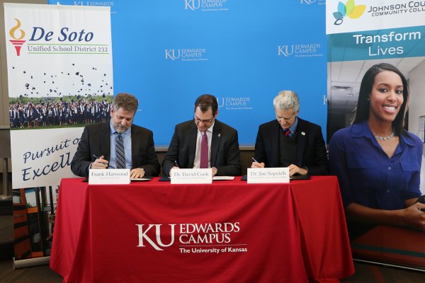 (From left) USD 232 Superintendent Frank Harwood, KU Edwards Campus Vice Chancellor David Cook and Johnson County Community College President Joe Sopcich sign their new Degree in 3 partnership into effect during a celebration at the KU Edwards Campus on Jan. 24.
