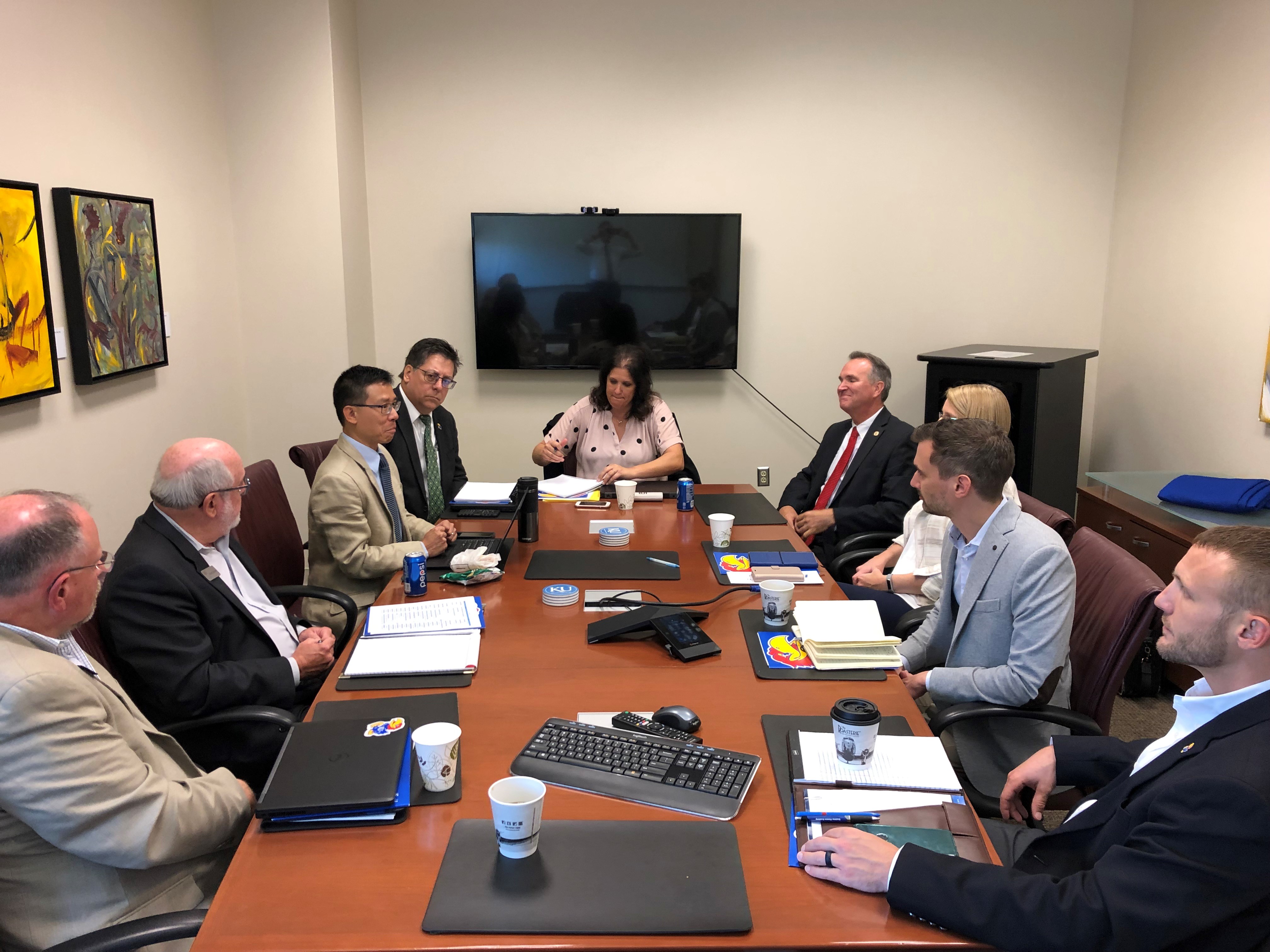 Government and Kansas University leaders meet to discuss collaborative projects for ensuring a highly-skilled government workforce.