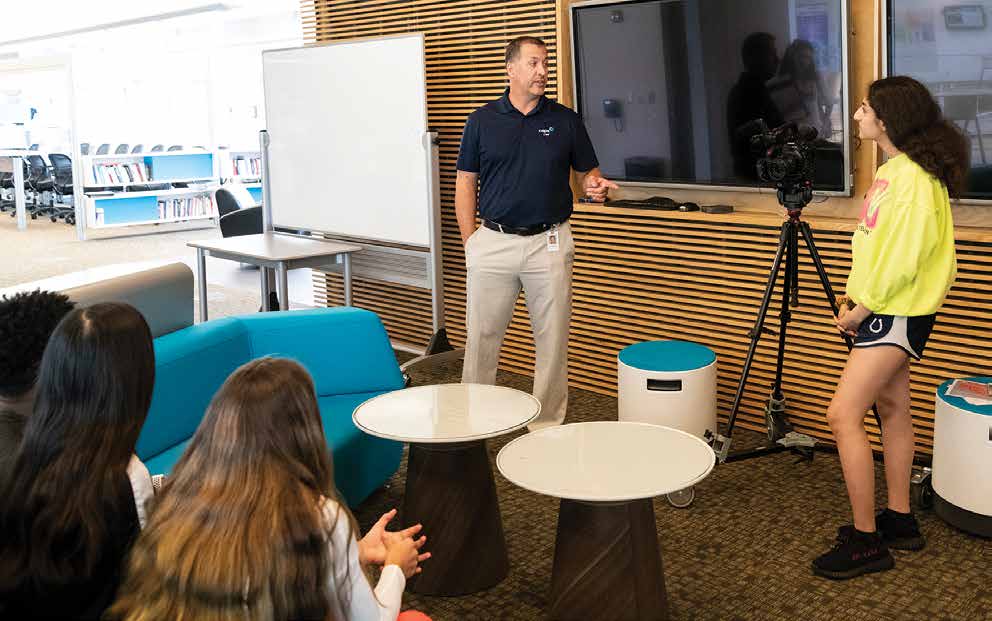 Chad Ralston, director at Blue Valley CAPS in Overland Park, visits with high school students to create a “mockumentary” for a filmmaking class. Photo by Steve Puppe.