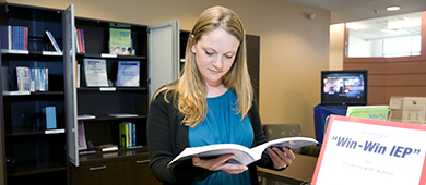 A person reading in the Autism Resource Center