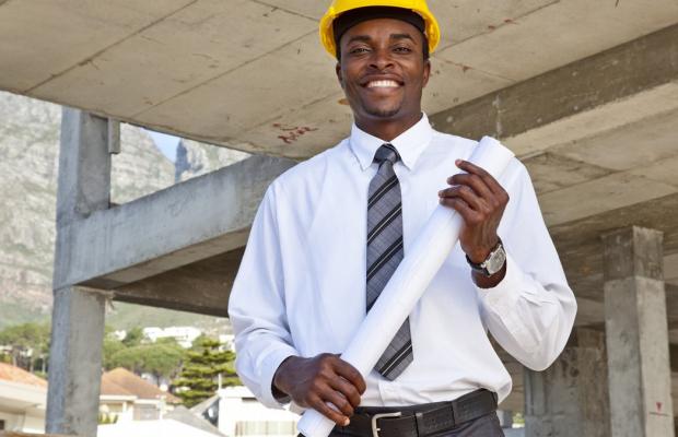 Adult in business attire and hard hat
