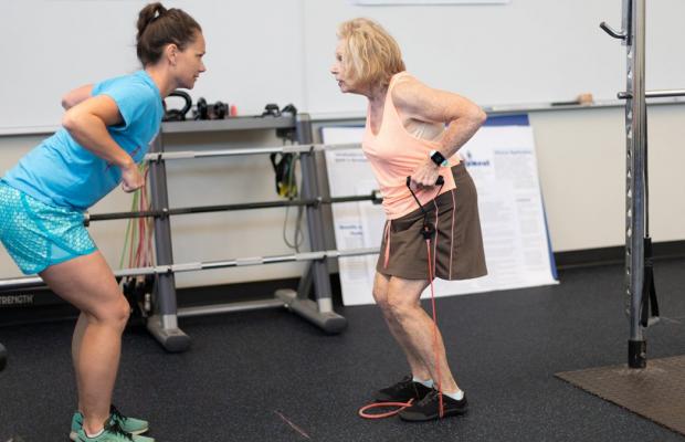 Student collaborates in exercise clinical trial with older adult