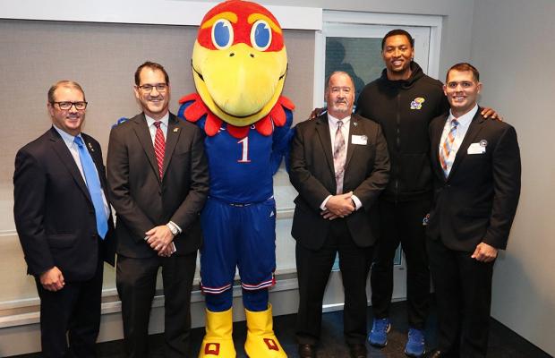 Group of KU officials with the Jayhawk