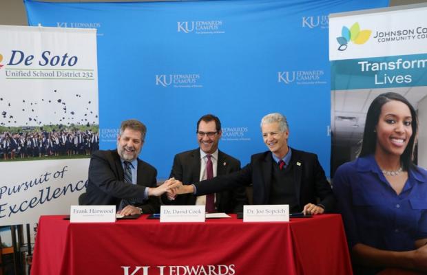 (From left) USD 232 Superintendent Frank Harwood, KU Edwards Campus Vice Chancellor David Cook and Johnson County Community College President Joe Sopcich sign their new Degree in 3 partnership into effect during a celebration at the KU Edwards Campus on Jan. 24.