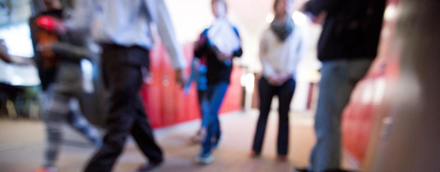 People walking in a school hallway