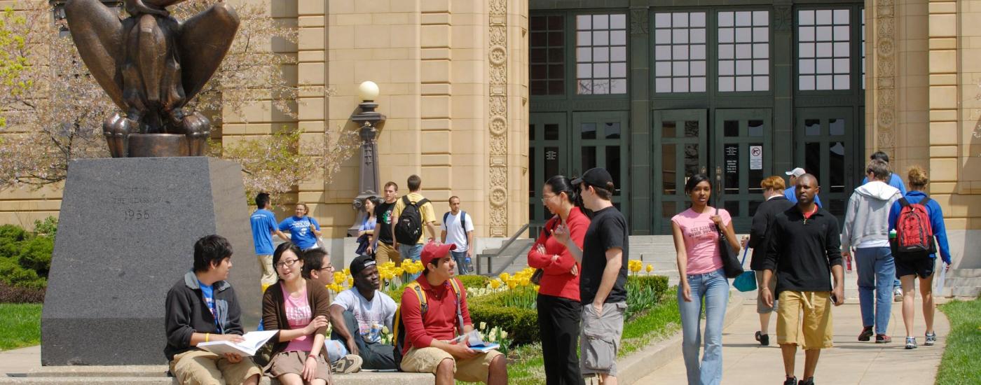 Higher Education students outside of Strong Hall at KU